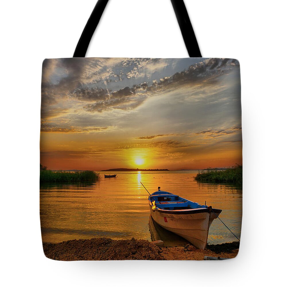 Sunset Tote Bag featuring the photograph Sunset over lake by Lilia D