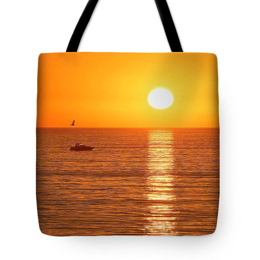 Ocean Tote Bag featuring the photograph Sunset Solitude by Ed Clark