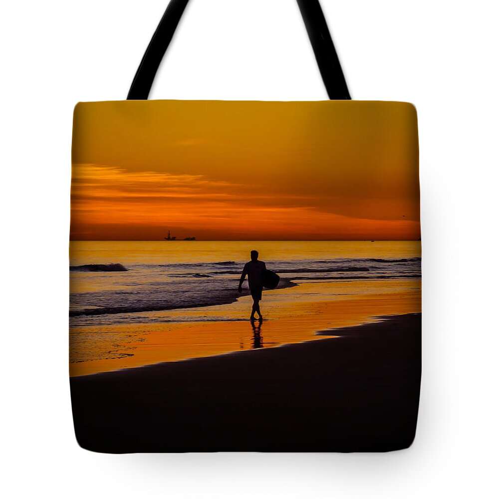 Newport Beach Tote Bag featuring the photograph Sunset Surfer by Pamela Newcomb