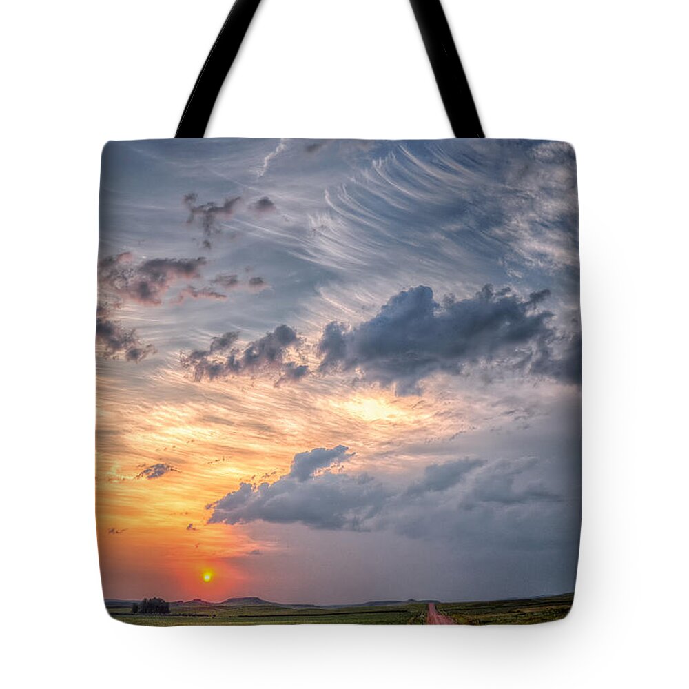 Landscape Tote Bag featuring the photograph Sunshine and Storm Clouds by Fiskr Larsen