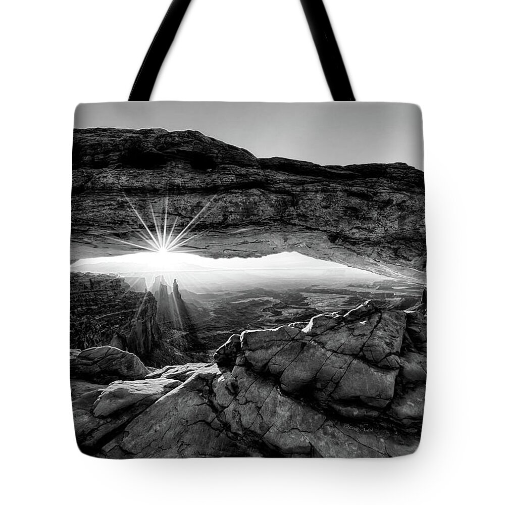 Mesa Arch; Utah; Canyonlands; National Park; Sunrise; Arch; Red; Brown; Desert; Butte; Dawn; Morning; Remote; Beauty; Sun; Sunburst; Rays; Sunlight Glowing Tote Bag featuring the digital art Supernatural West - Mesa Arch Sunburst in Black and White by Lena Owens - OLena Art Vibrant Palette Knife and Graphic Design