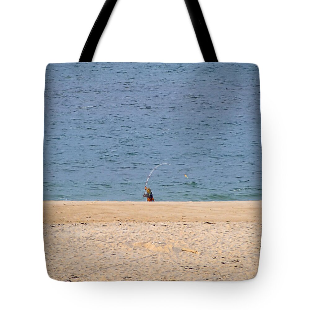 Surf Caster Tote Bag featuring the photograph Surf Caster by Newwwman