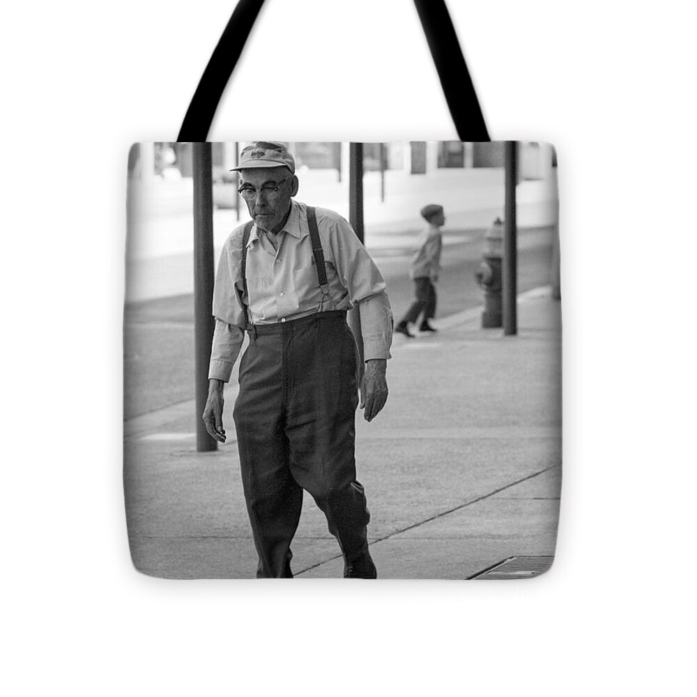 Actions Tote Bag featuring the photograph Suspenders by Mike Evangelist