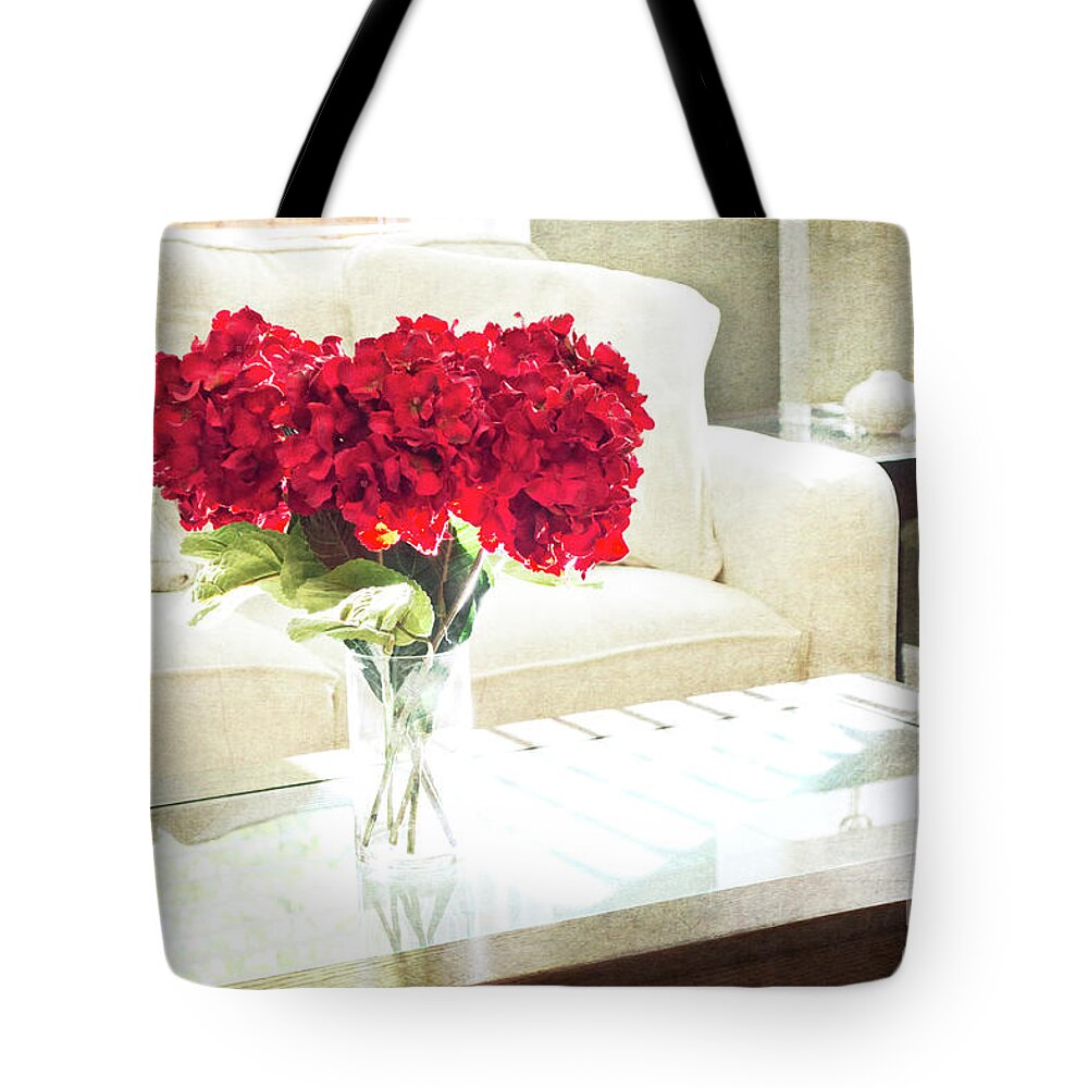 Red Tote Bag featuring the photograph Table with Red Flowers by Maria Janicki