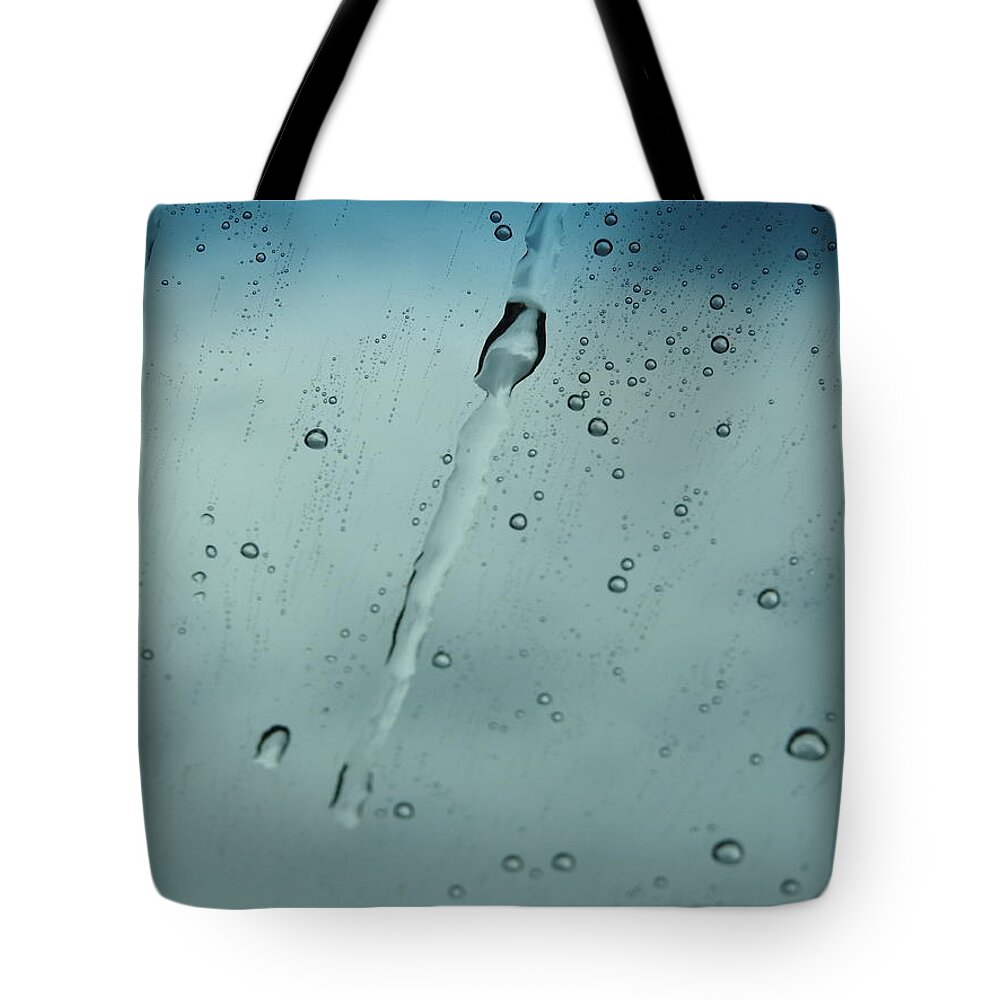 Weather Tote Bag featuring the photograph Teardrops of Rain by Jan Gelders