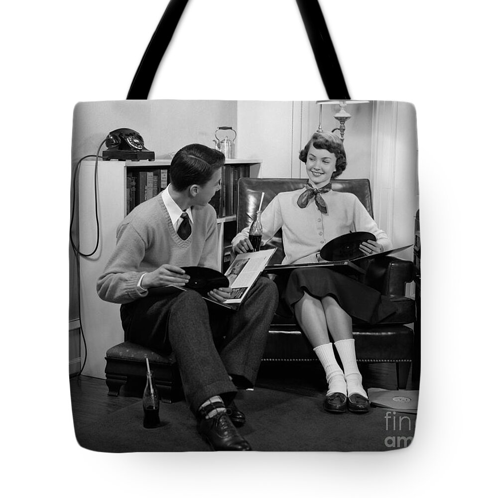 1950s Tote Bag featuring the photograph Teen Couple Listening To Records by H. Armstrong Roberts/ClassicStock