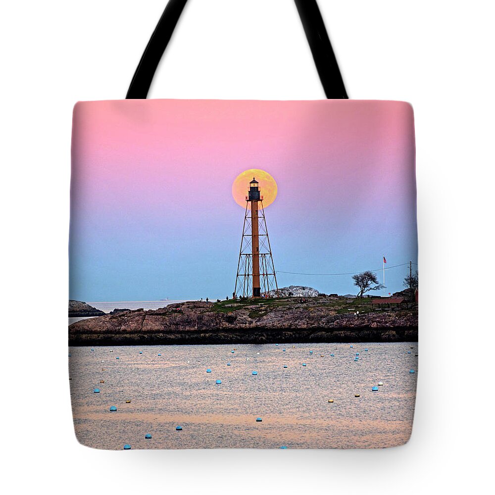 Marblehead Tote Bag featuring the photograph The 2016 Supermoon balancing on the Marblehead Light Tower in Marblehead MA Harbor by Toby McGuire