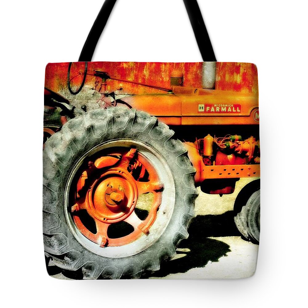 Tractor Tote Bag featuring the photograph The Big Wheel by Diana Angstadt