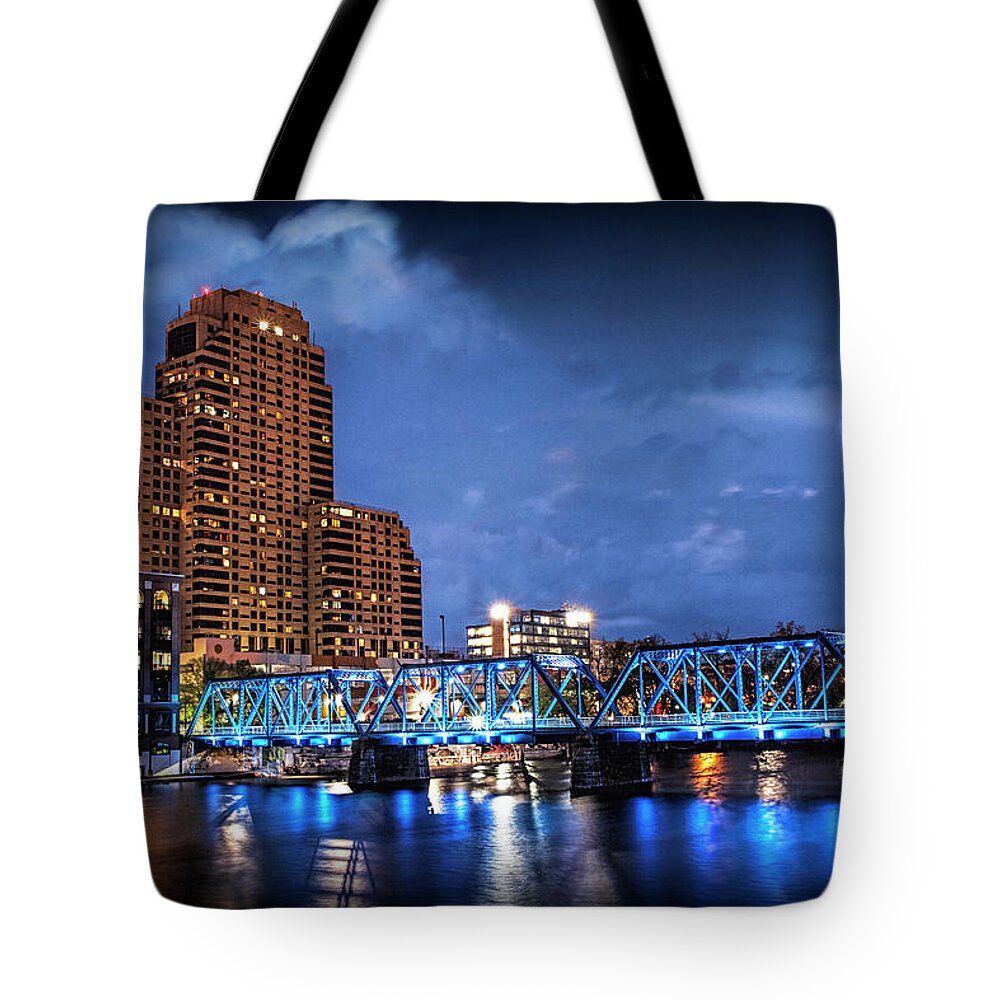 Bridge Tote Bag featuring the photograph The Blue Walking Bridge at Night in Grand Rapids by Randall Nyhof
