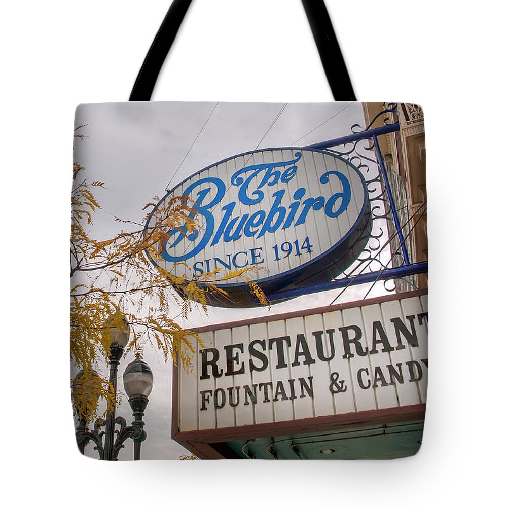 The Bluebird Tote Bag featuring the photograph The Bluebird by Kristina Rinell