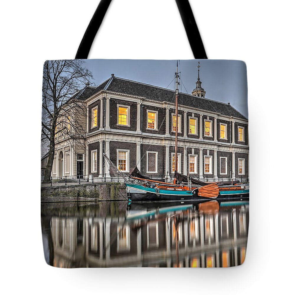 Schiedam Tote Bag featuring the photograph The Corn Exchange in Schiedam by Frans Blok