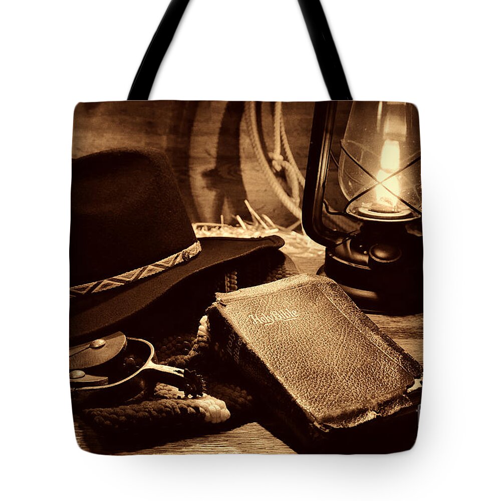 Antique Tote Bag featuring the photograph The Cowboy Bible by American West Legend By Olivier Le Queinec