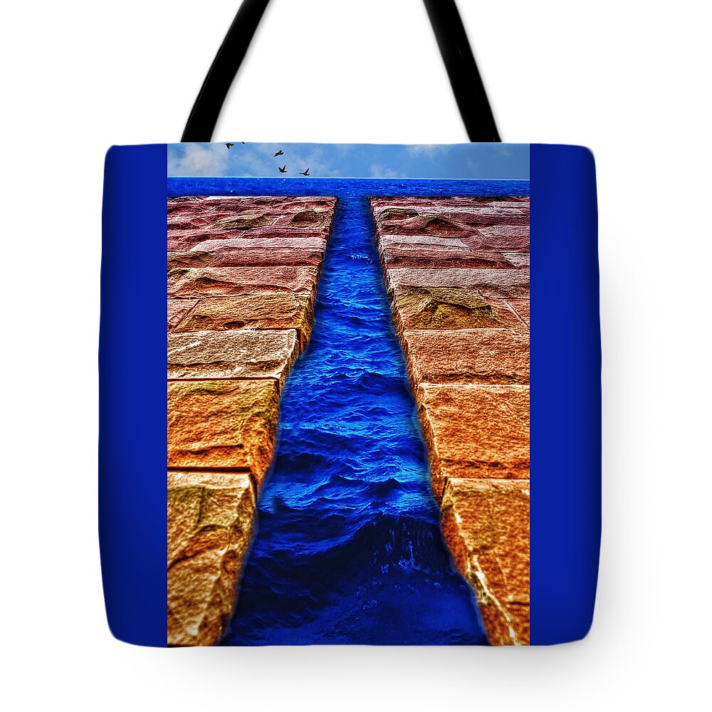 The Divide Tote Bag featuring the photograph The Divide by Paul Wear