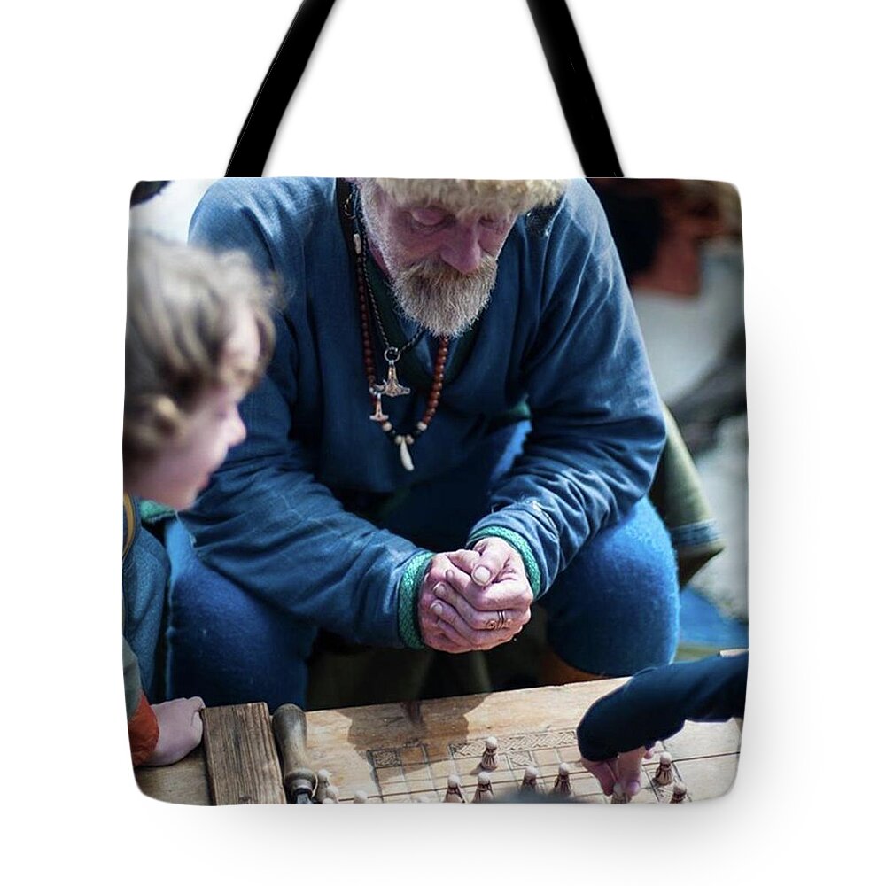 Play Tote Bag featuring the photograph The Game by Aleck Cartwright