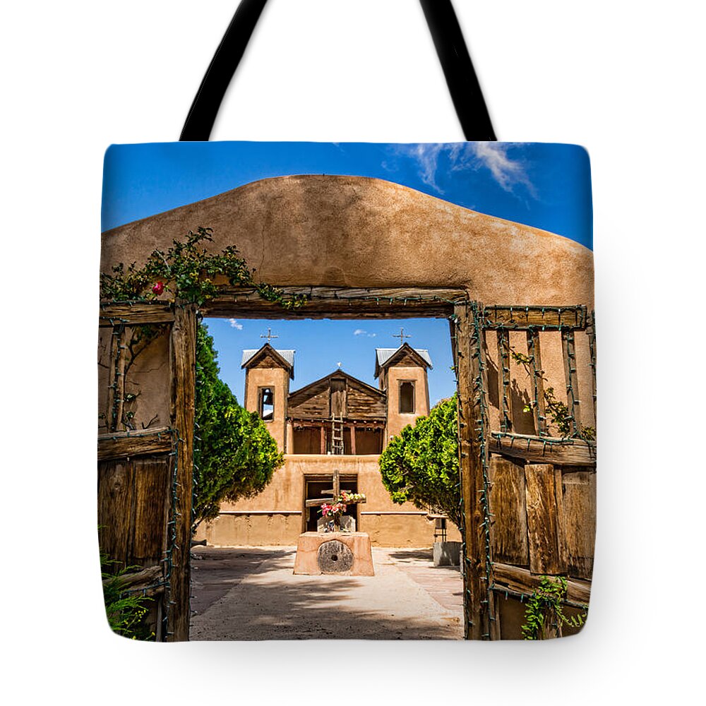 Adobe Tote Bag featuring the photograph The Gates of Chimayo by Paul LeSage