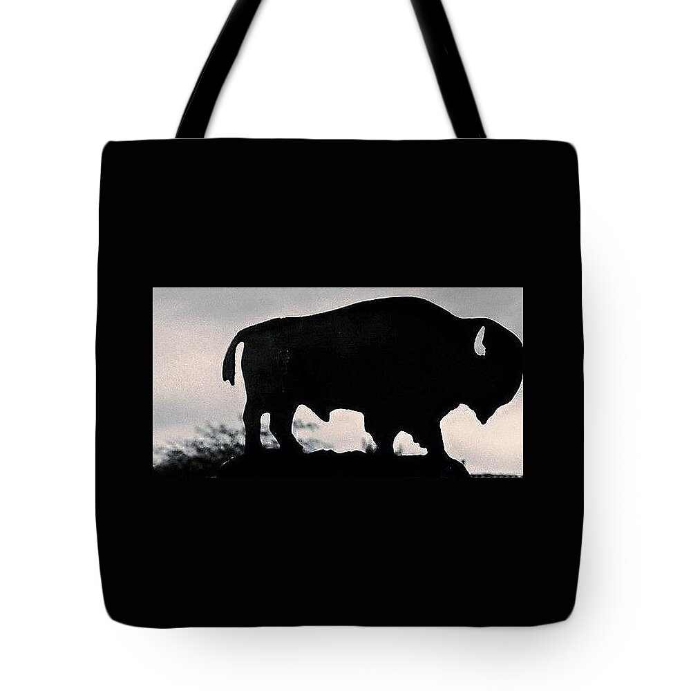 Iron Buffalo Tote Bag featuring the photograph The Iron Buffalo Push by John Glass