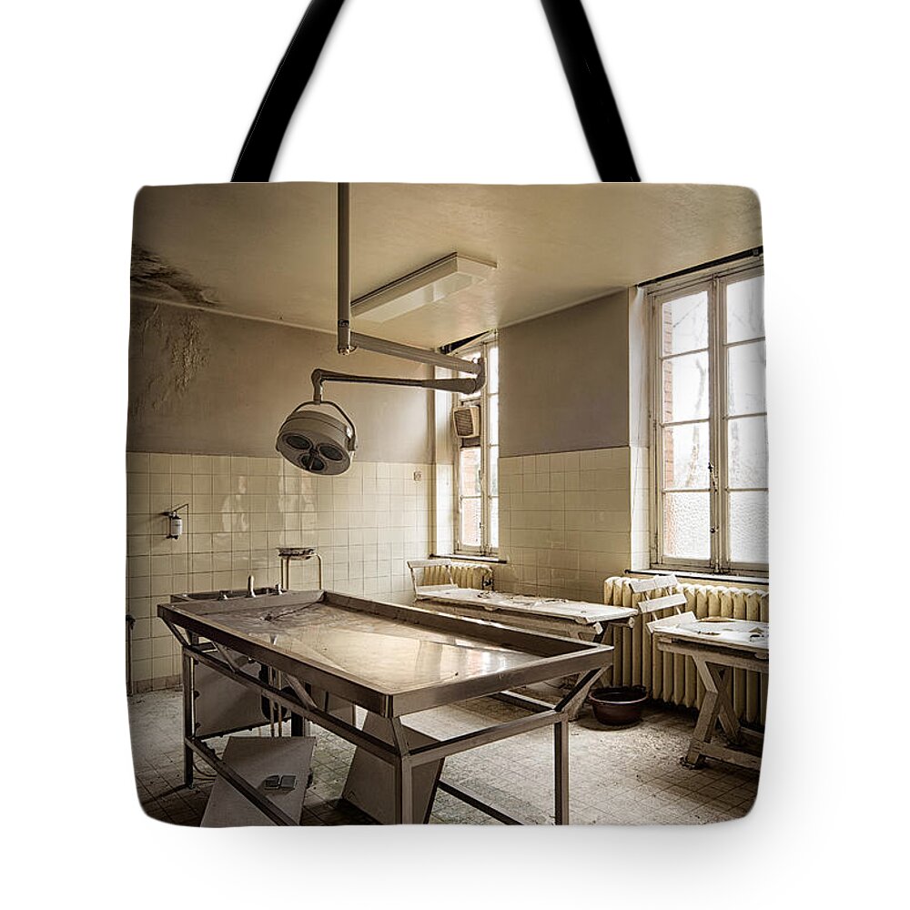 Abandoned Tote Bag featuring the photograph the morgue autopsy table - Urban exploration by Dirk Ercken