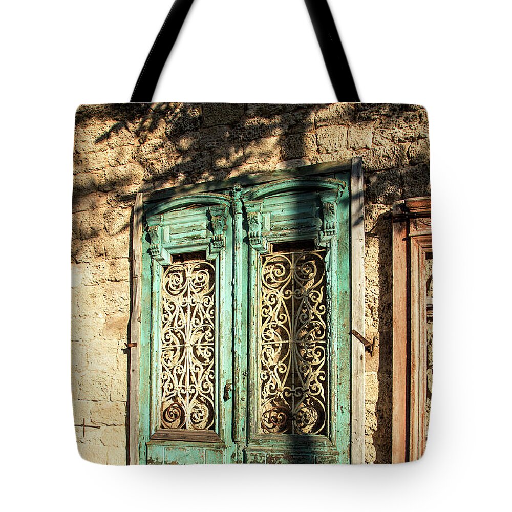 Old Tote Bag featuring the photograph The old green door by Adriana Zoon