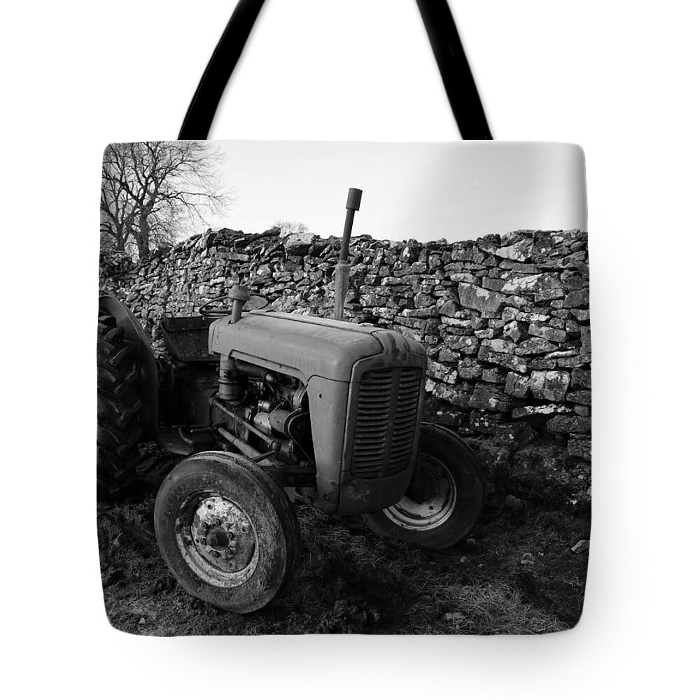 Old Tote Bag featuring the photograph The Old Tractor black and white by Lukasz Ryszka