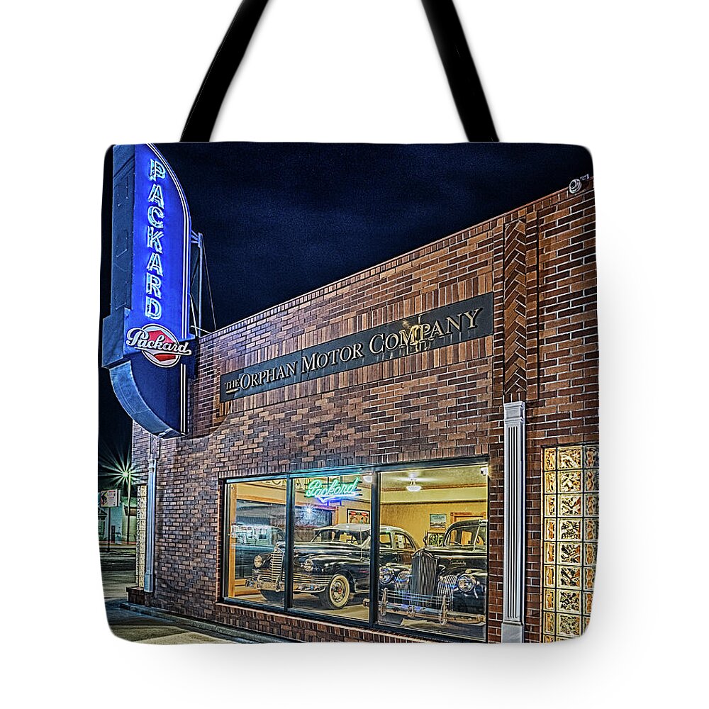 Packard Tote Bag featuring the photograph The Orphan Motor Company by Susan Rissi Tregoning