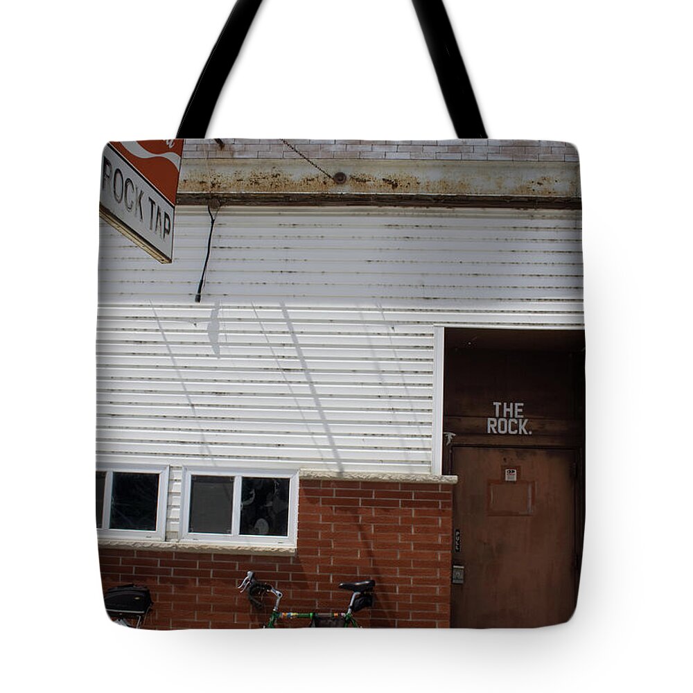 The Rock Bike Tote Bag featuring the photograph The Rock Bike by Dylan Punke
