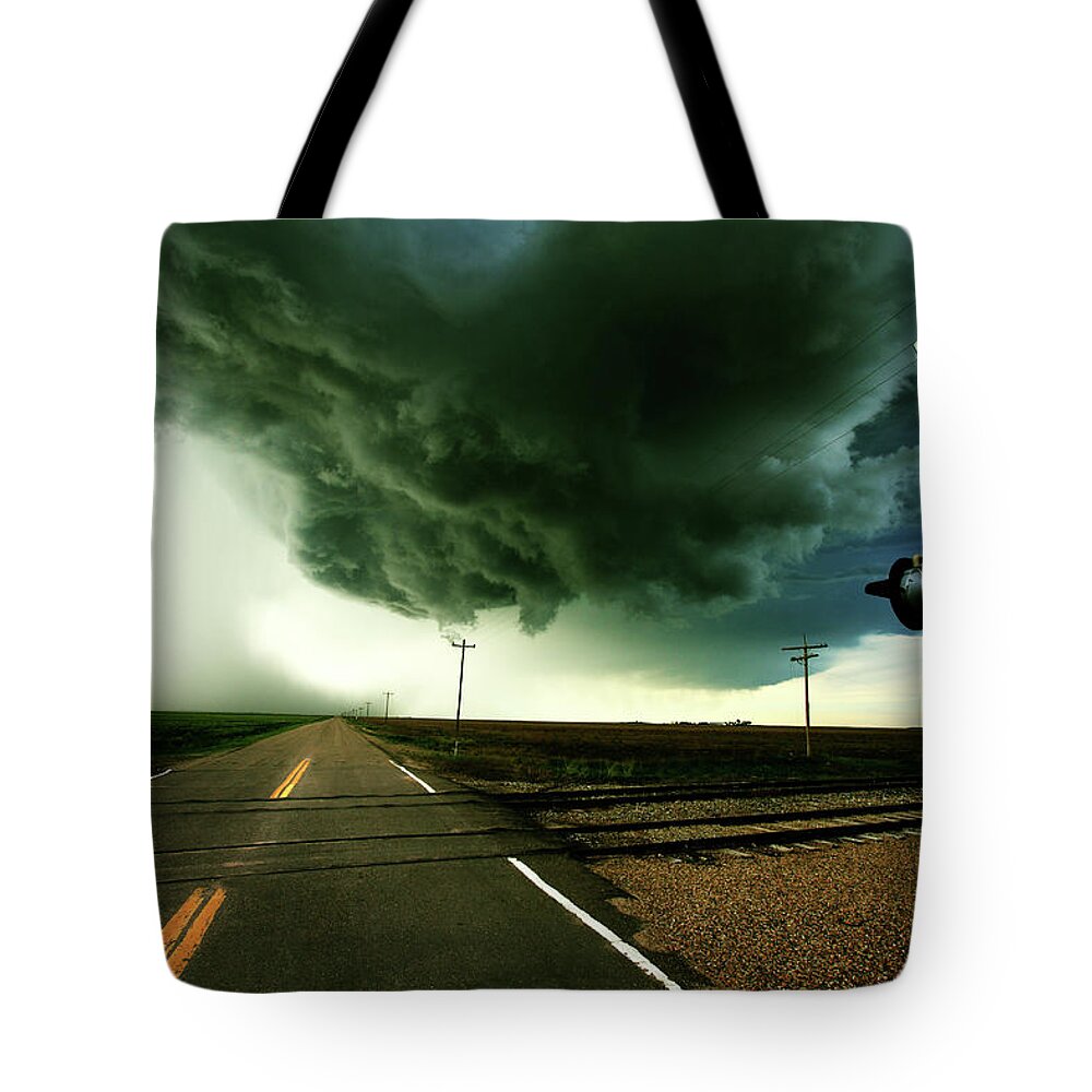 Weather Tote Bag featuring the photograph The Rough Road Ahead by Brian Gustafson