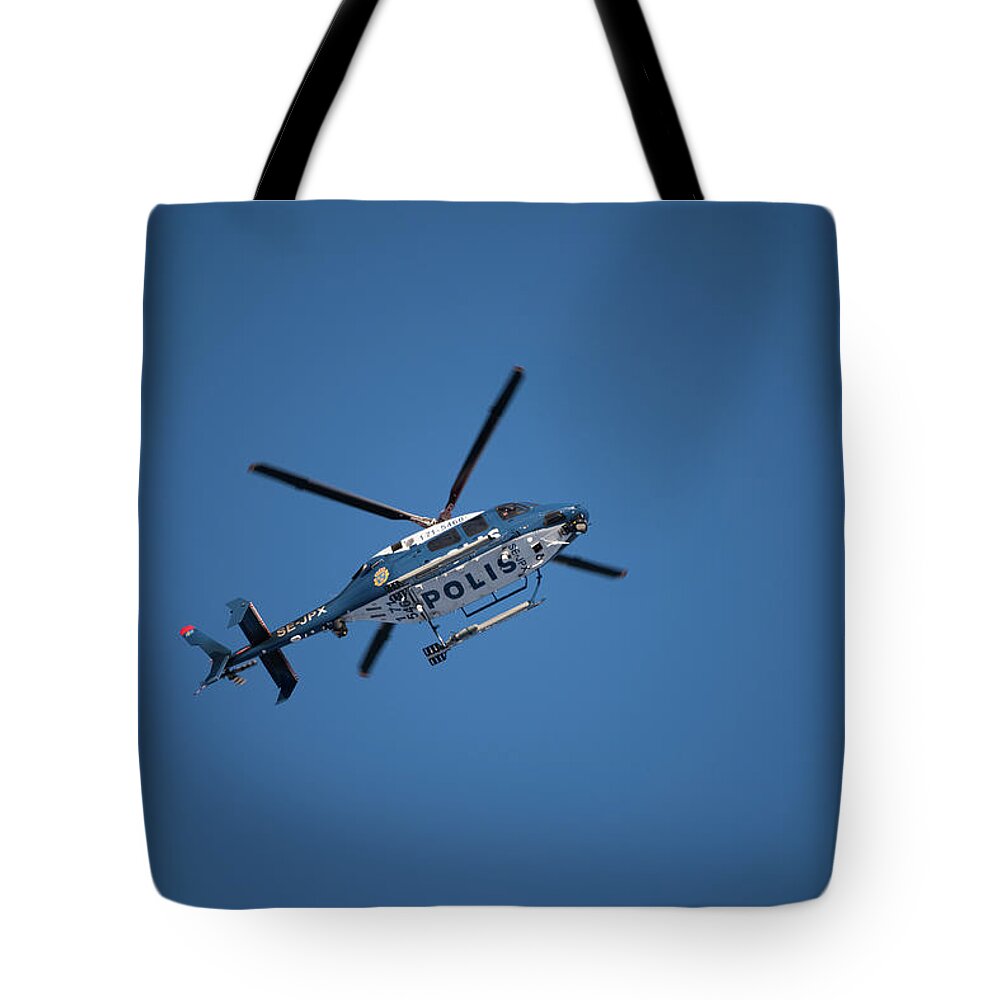 Swedish Police Helicopter Tote Bag featuring the photograph The searcher in the air by Torbjorn Swenelius