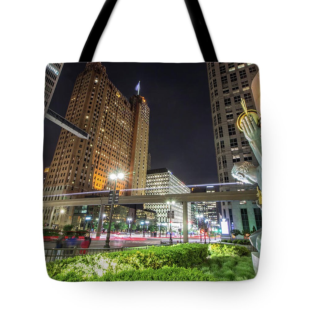 Detroit Tote Bag featuring the photograph The SPIRIT looking on in Downtown Detroit by Jay Smith
