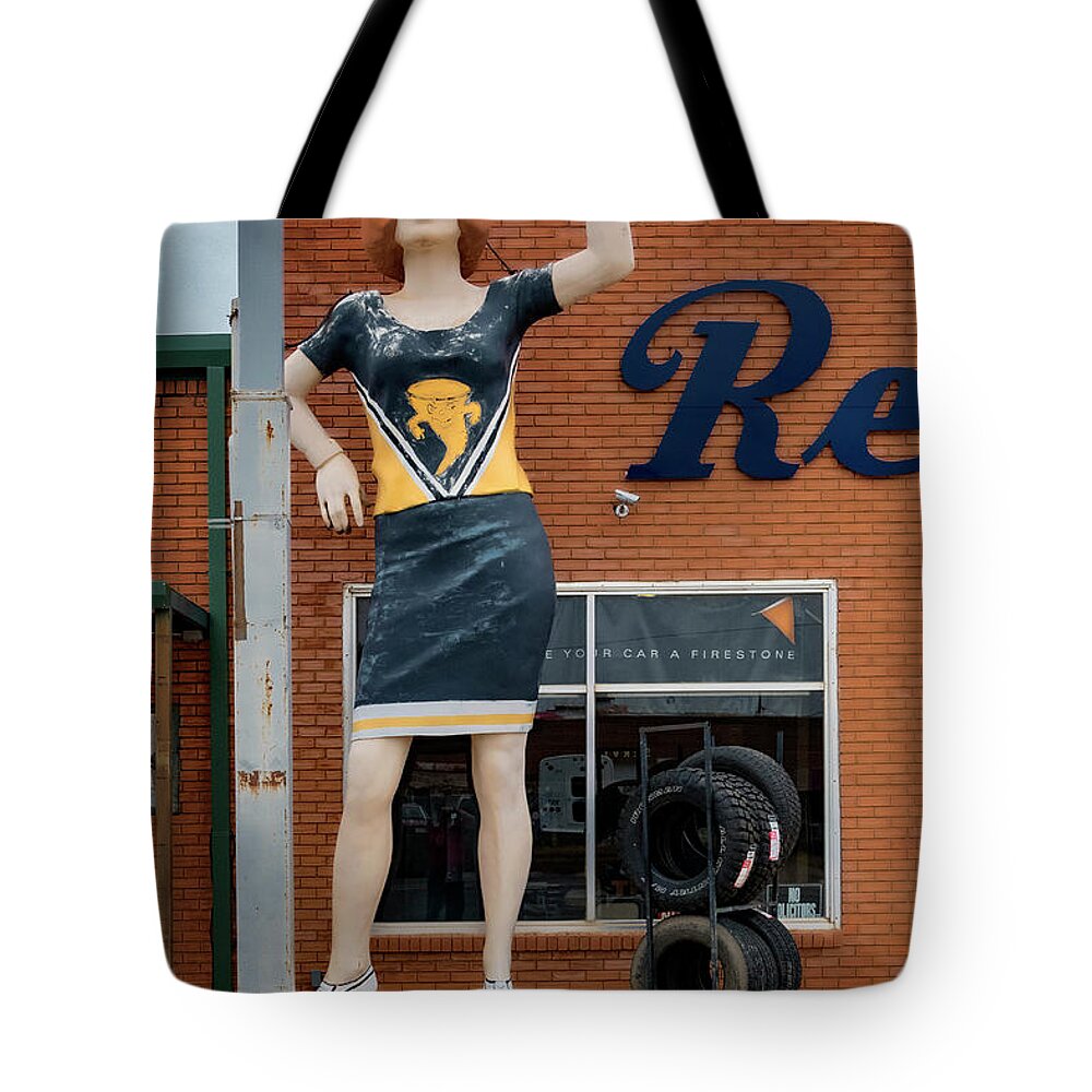 Giant Fiberglass Statues Tote Bag featuring the photograph The Tornadoes Cheerleader by Gary Warnimont
