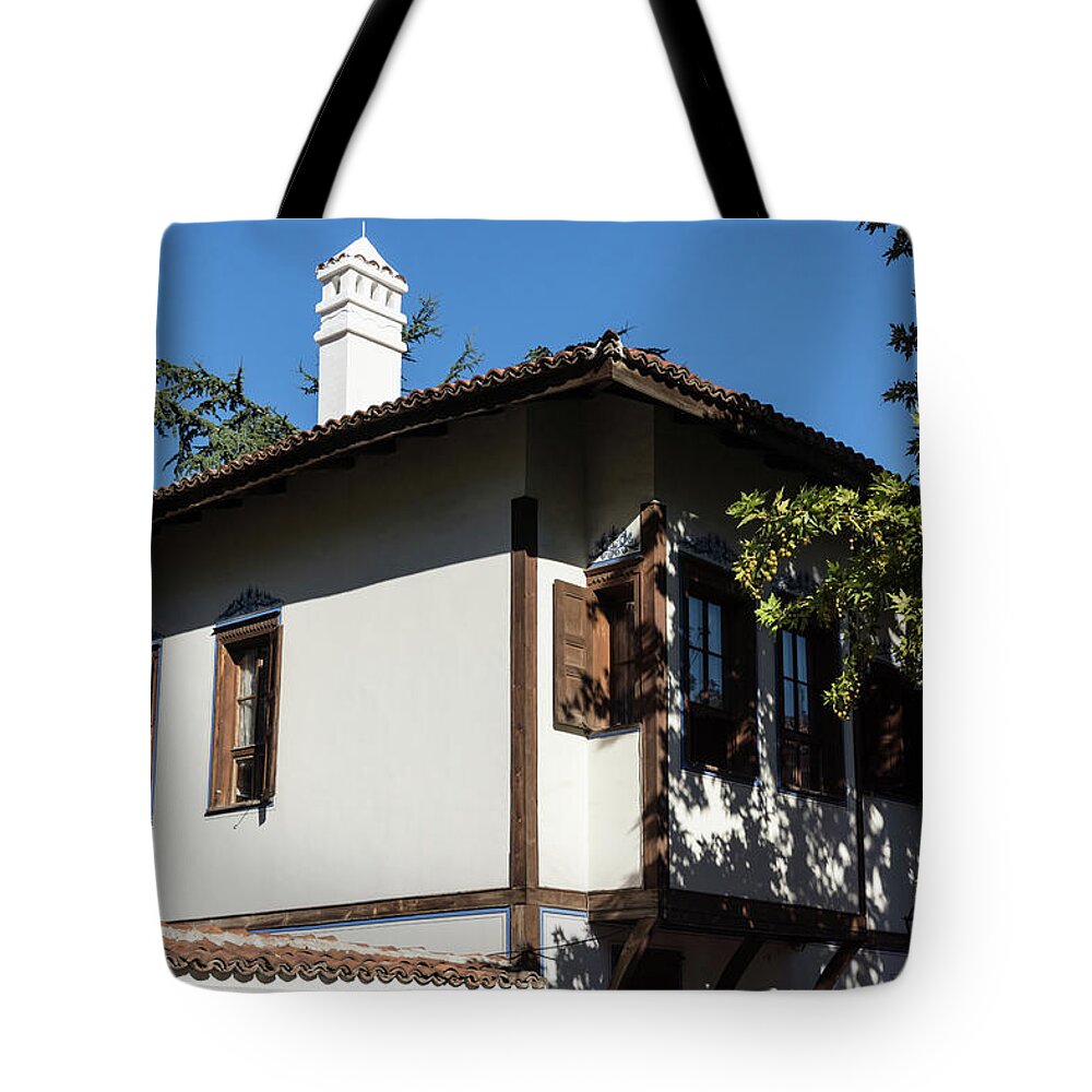 Georgia Mizuleva Tote Bag featuring the photograph The White Chimney - Sun Dappled Elegant Revival House by Georgia Mizuleva