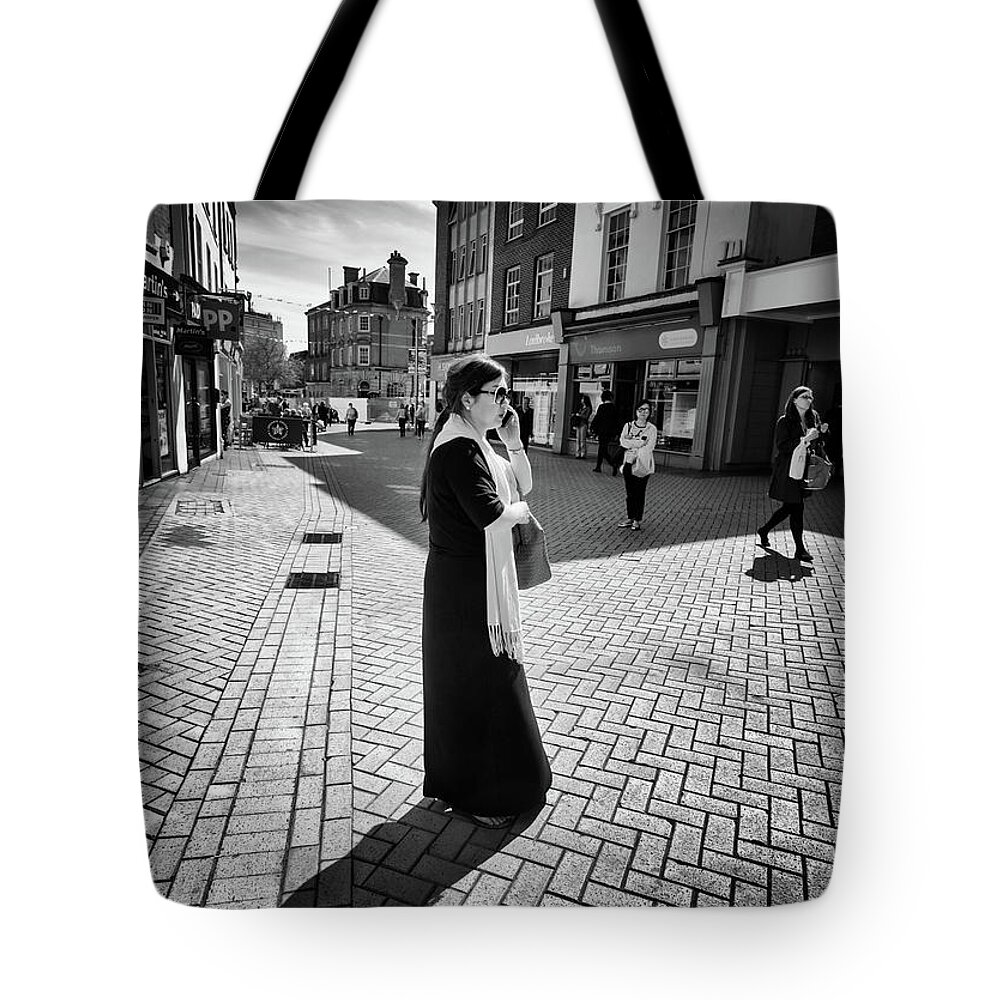 Women Tote Bag featuring the photograph The Woman Her Phone and Diagonal Shadow by John Williams