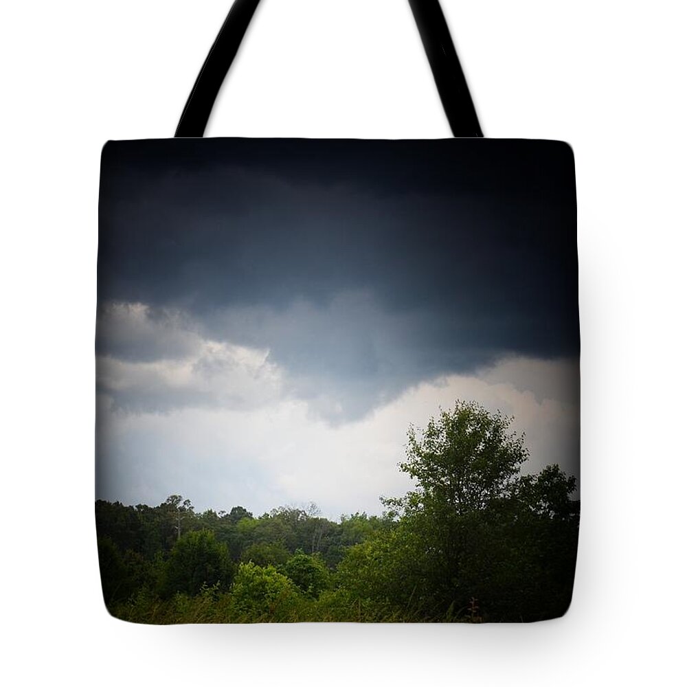 Threatening Skies Tote Bag featuring the photograph Threatening Skies by Maria Urso