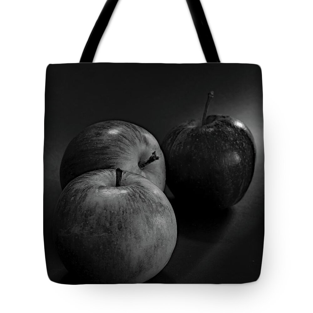 Three Apples Tote Bag featuring the photograph Three Apples Monochrome by Jeff Townsend