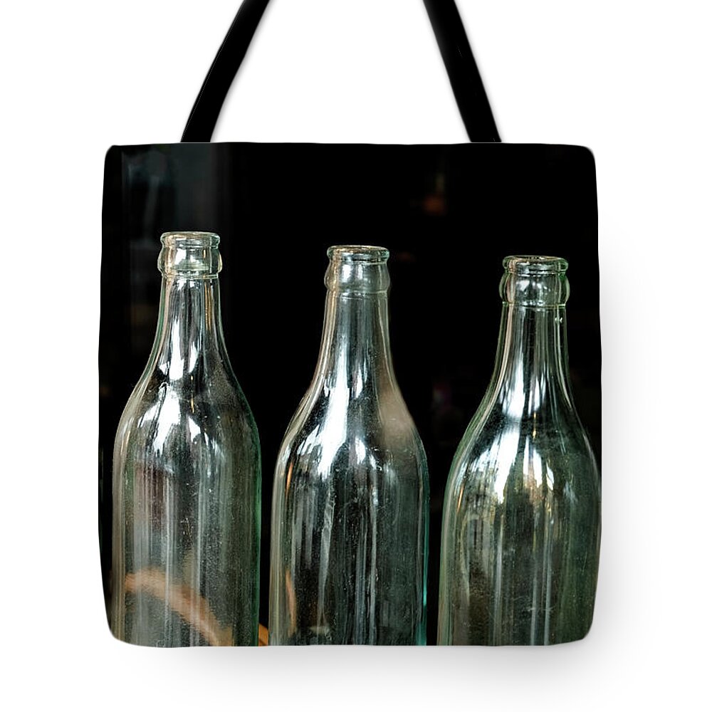 Whetstone Brook Tote Bag featuring the photograph Three Bottles by Tom Singleton