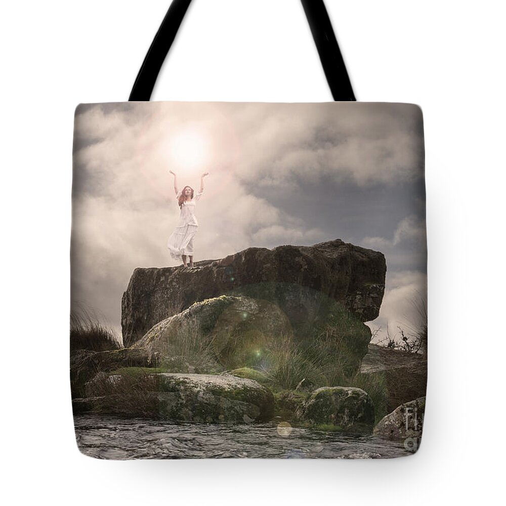 Woman Tote Bag featuring the photograph To hold the light by Clayton Bastiani