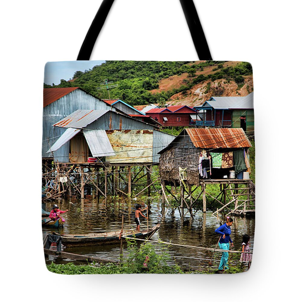 Cambodia Tote Bag featuring the photograph Tonle Sap Boat Village Cambodia by Chuck Kuhn