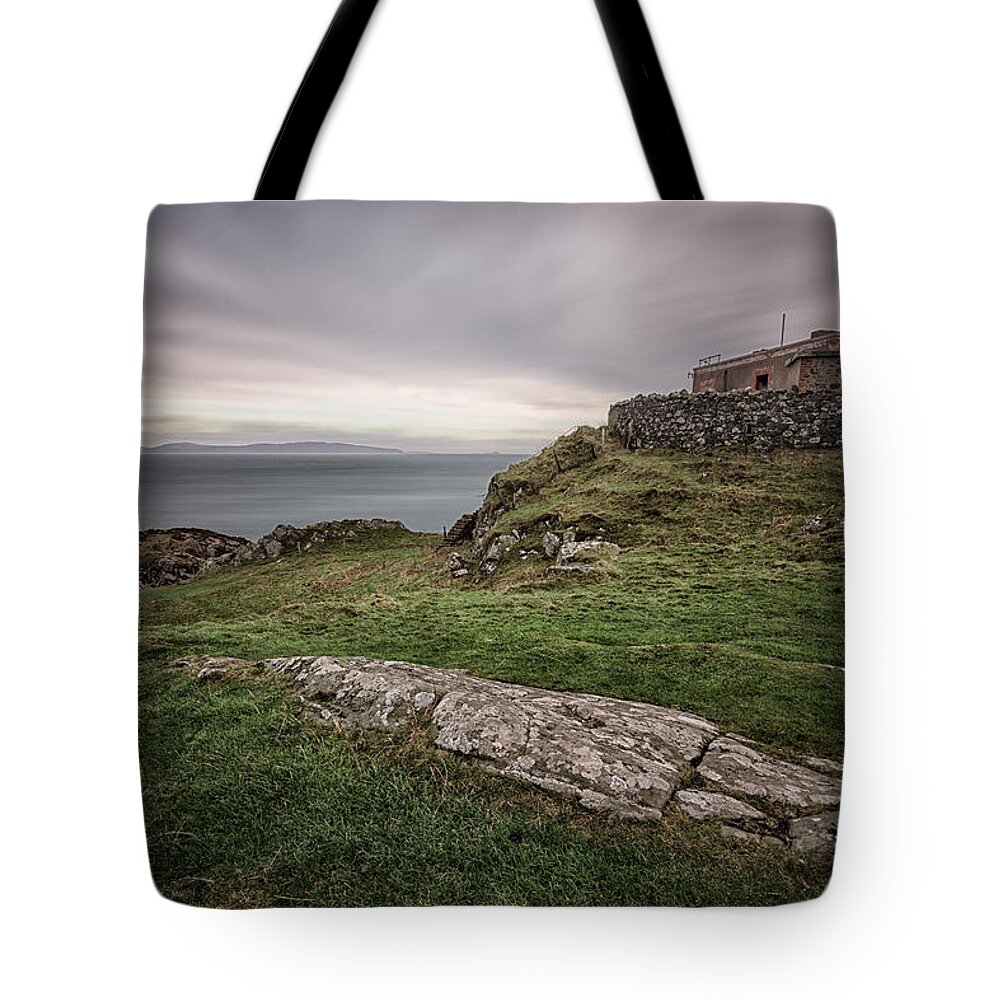 Torr Tote Bag featuring the photograph Torr Head by Nigel R Bell
