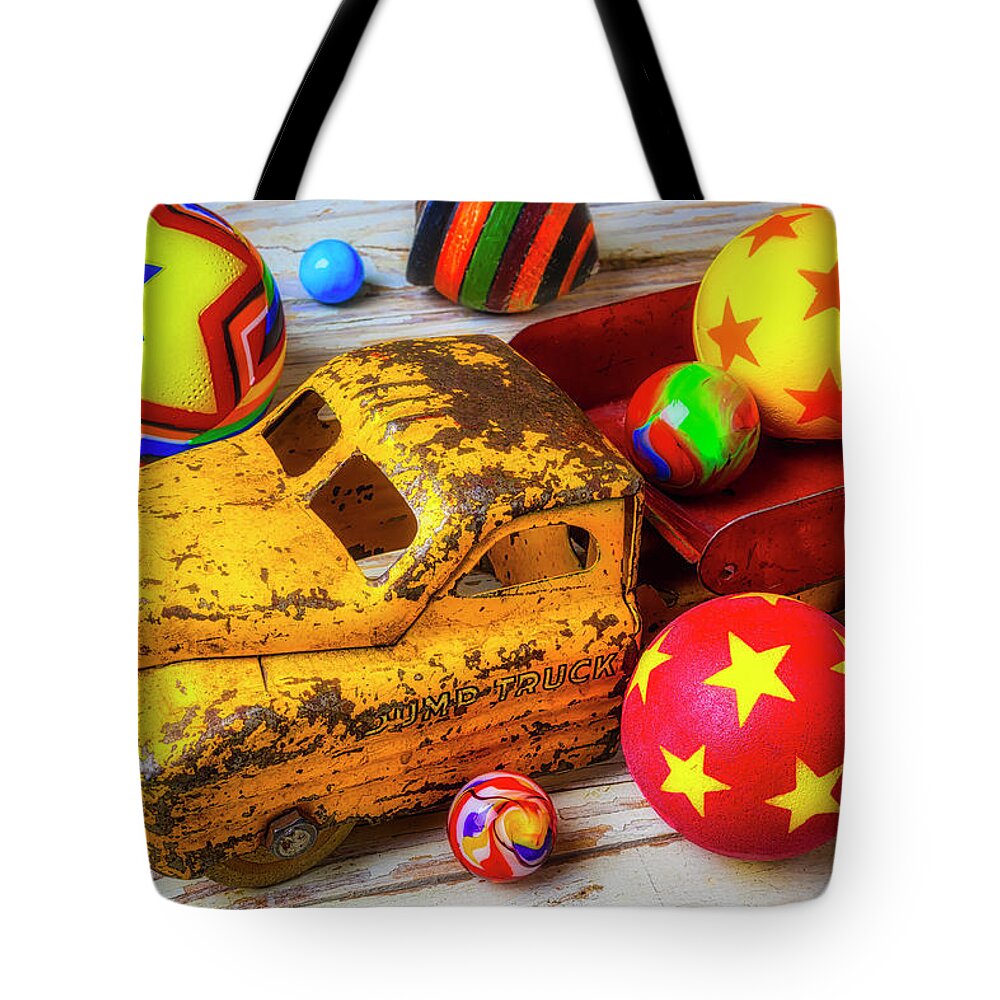Red Tote Bag featuring the photograph Toy Truck With Balls And Marbles by Garry Gay
