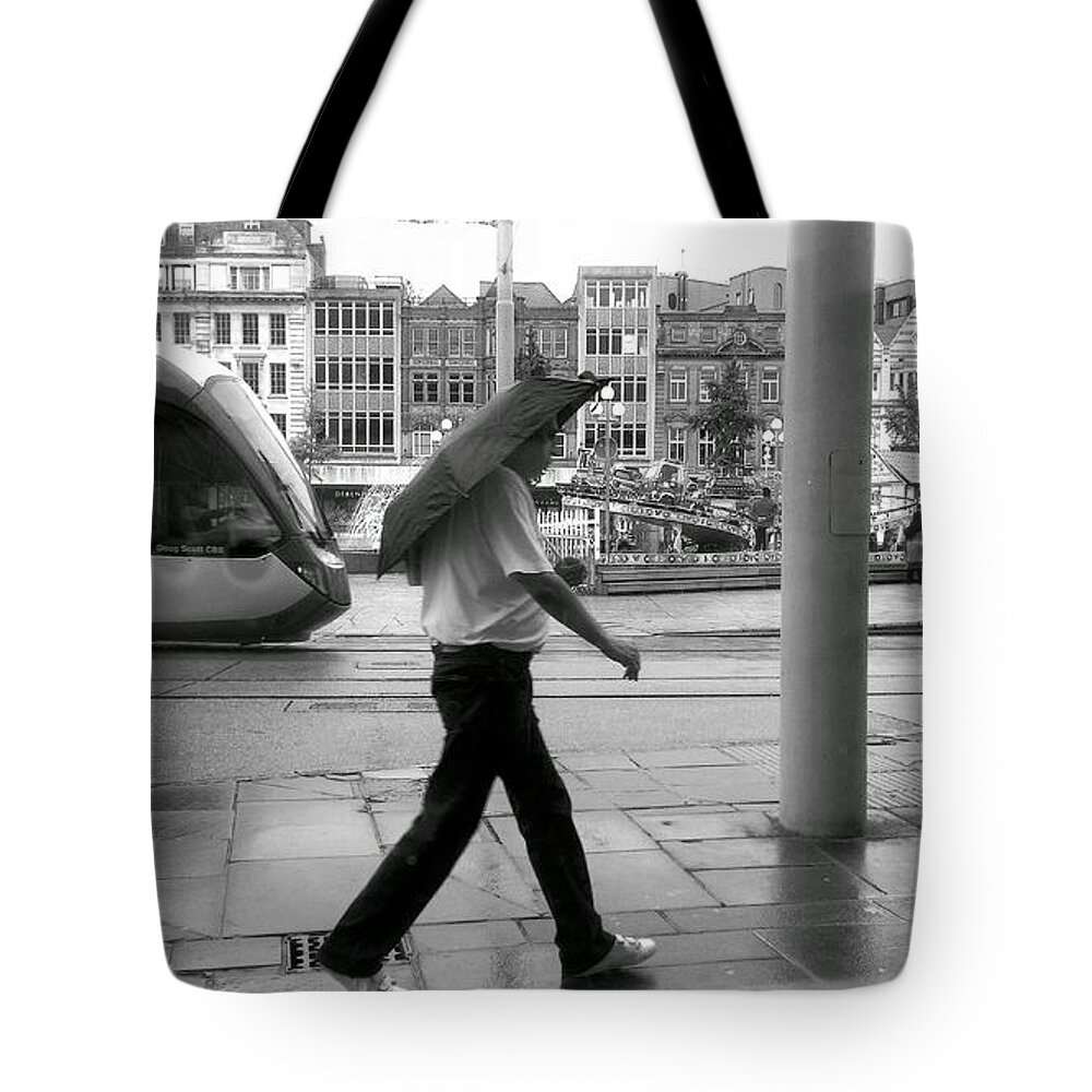 Architecture Tote Bag featuring the photograph Tram in Rainy City by Ieva Kambarovaite