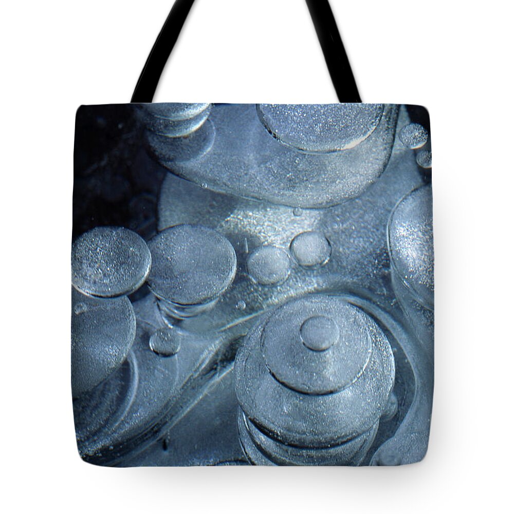 Winter Tote Bag featuring the photograph Trapped air bubbles in ice by Heiko Koehrer-Wagner