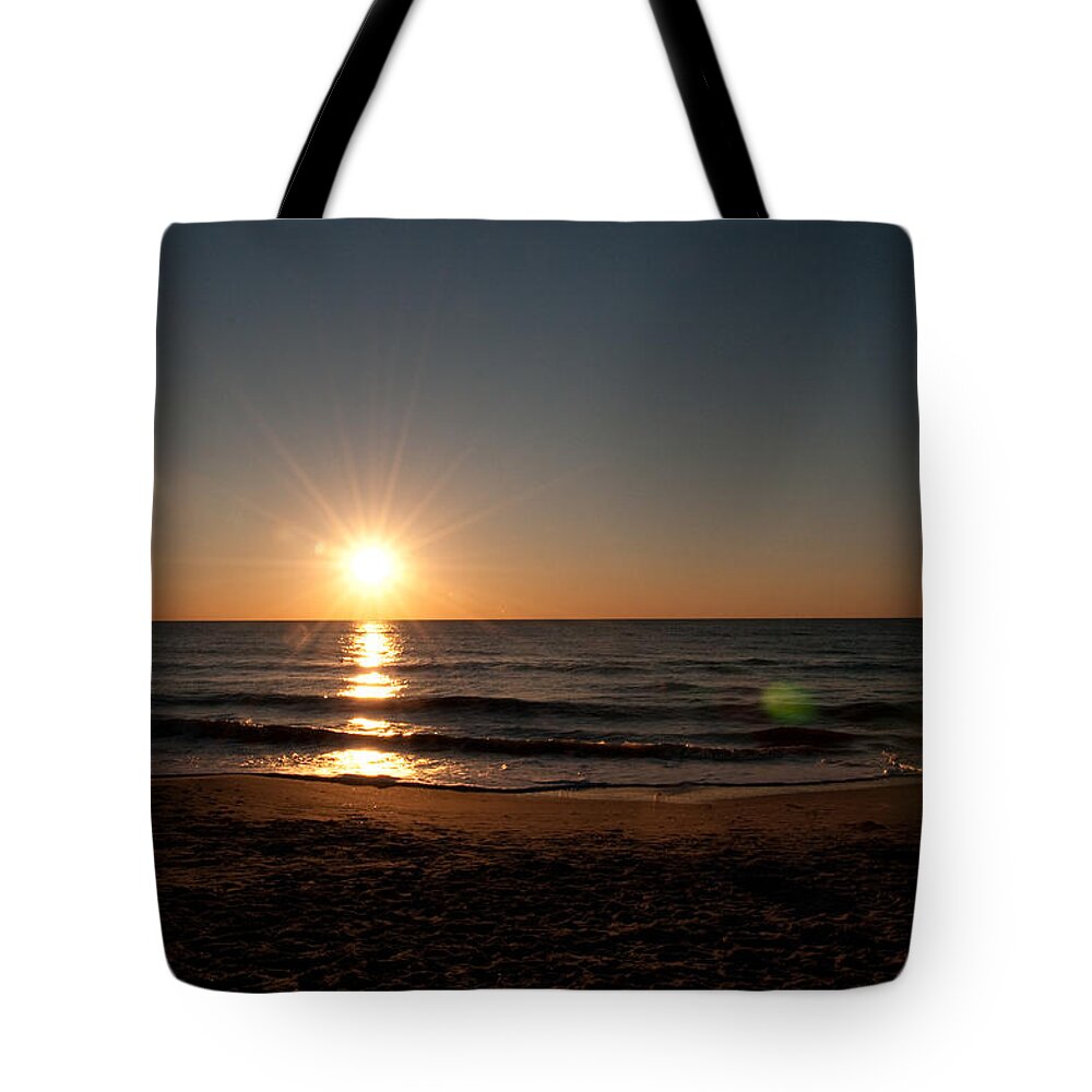 Beach Tote Bag featuring the photograph Turning Forty Three by Charles Dobbs
