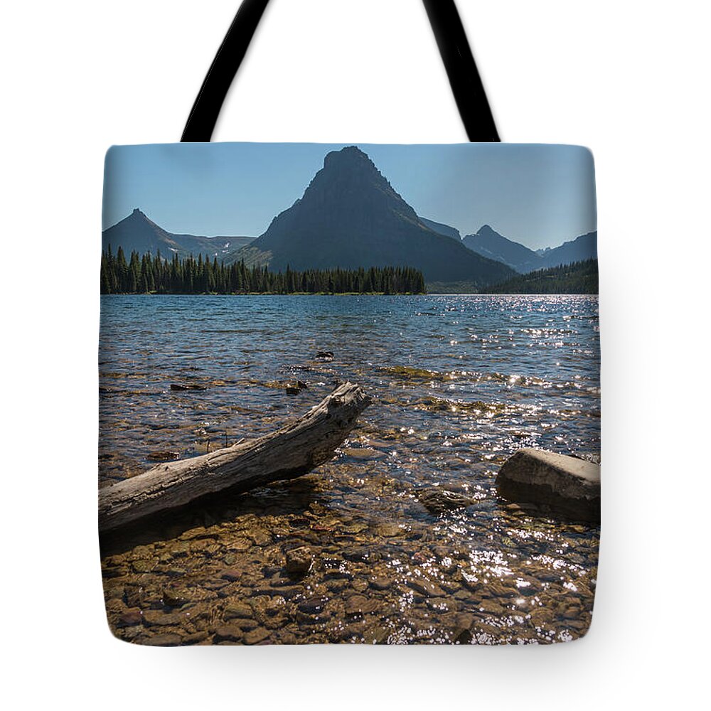 Two Medicine Lake Tote Bag featuring the photograph Two Medicine by Kristopher Schoenleber