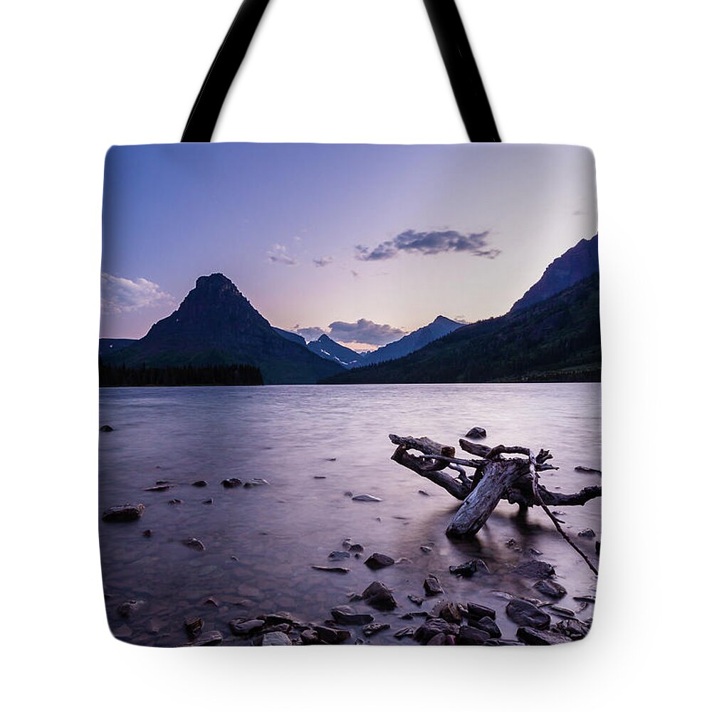 Clements Mountain Tote Bag featuring the photograph two medicine lake, MT 2 by Mati Krimerman