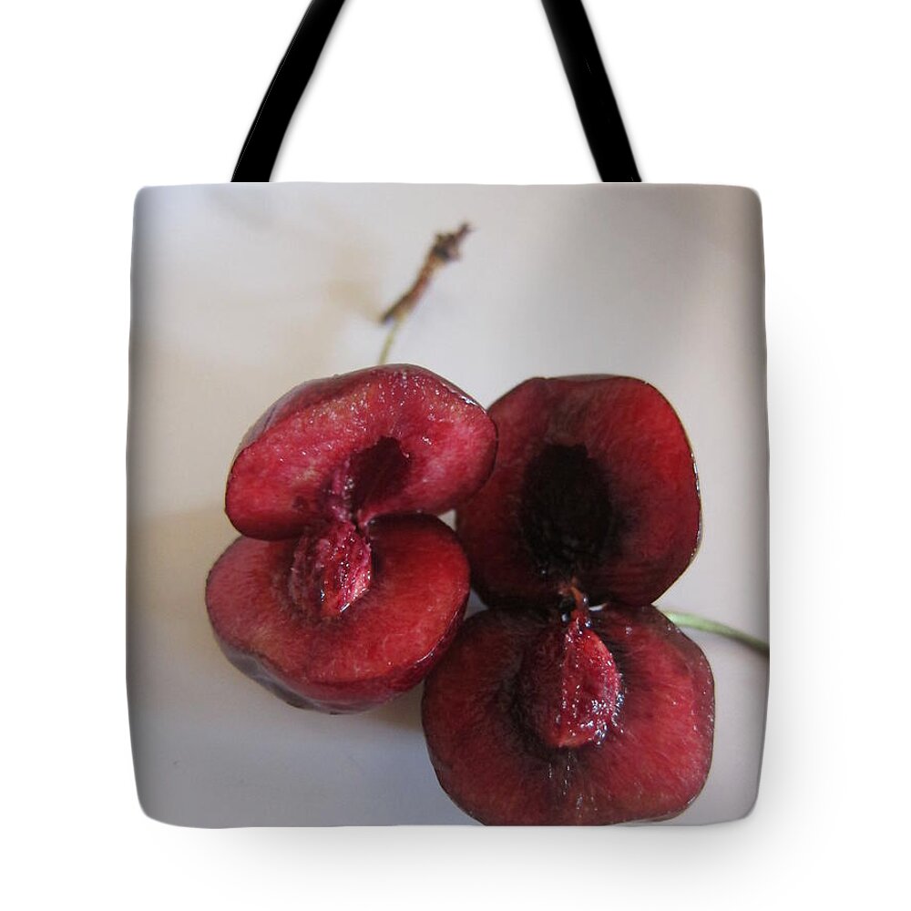 Art Tote Bag featuring the photograph Two Sliced Cherries by Funmi Adeshina