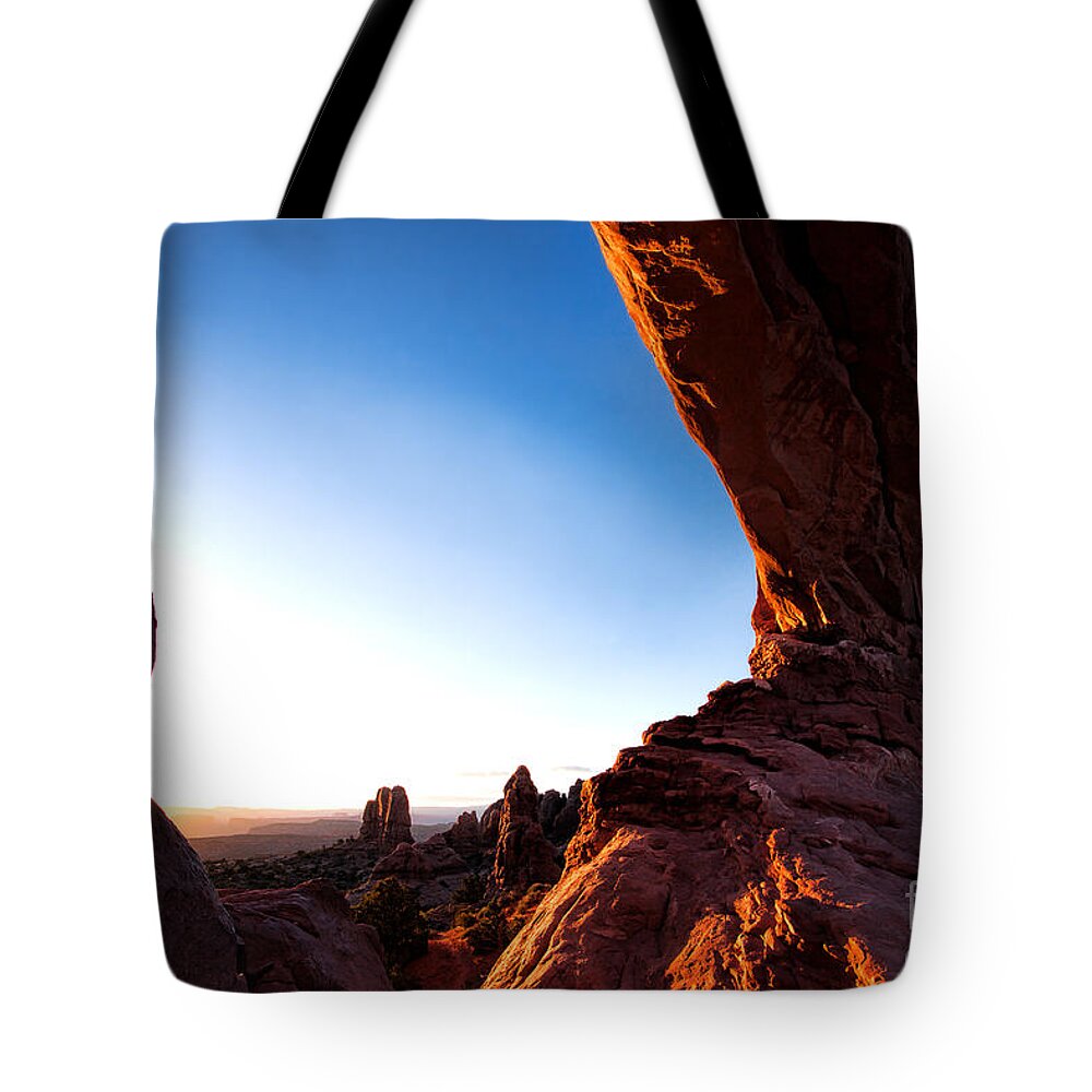 Landscape Tote Bag featuring the photograph Under the Arch by Jim Garrison