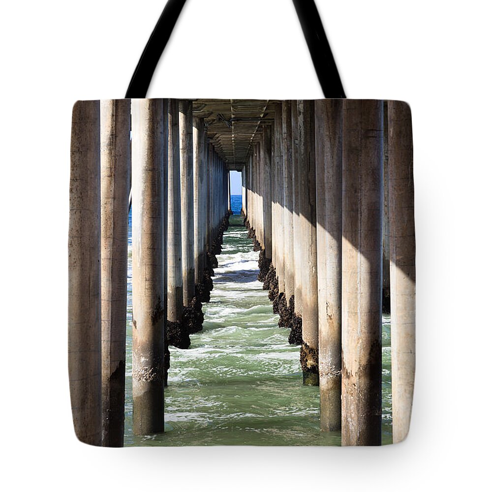 America Tote Bag featuring the photograph Under the Pier in Orange County California by Paul Velgos