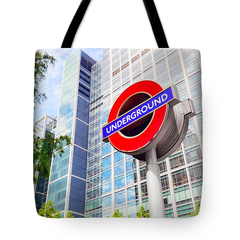 London Tote Bag featuring the photograph Underground sign in Canary Wharf financial district in London, UK by Michal Bednarek