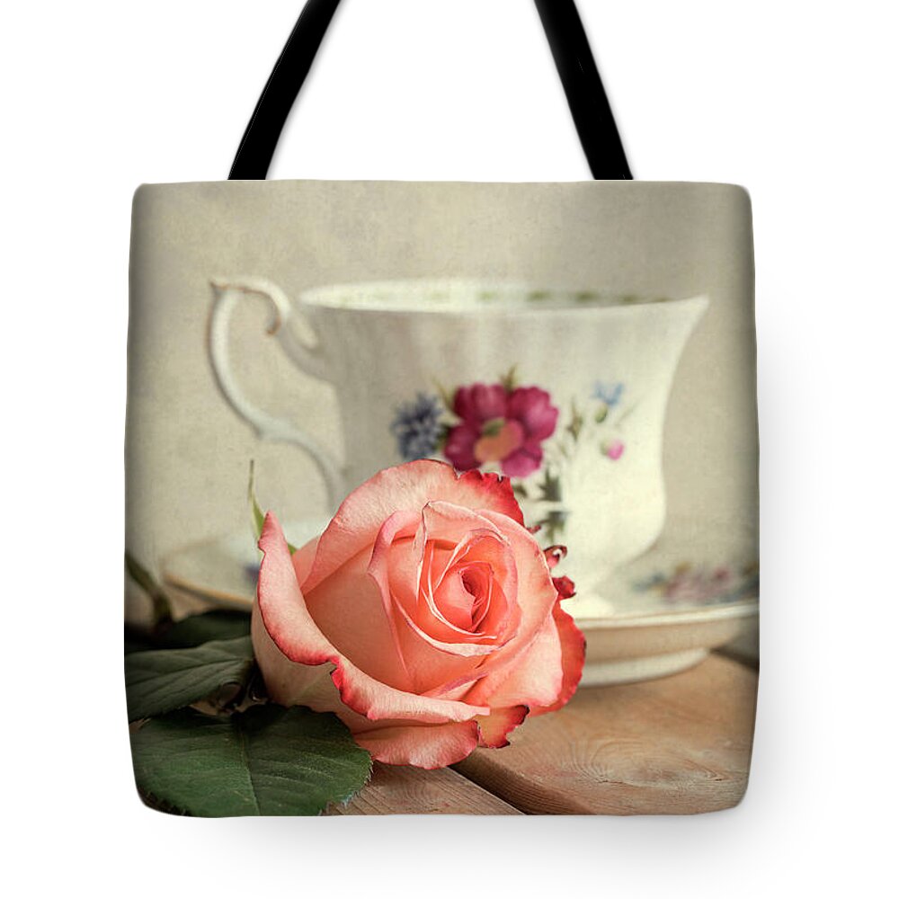 Rose Tote Bag featuring the photograph Unfinished tea by Jaroslaw Blaminsky