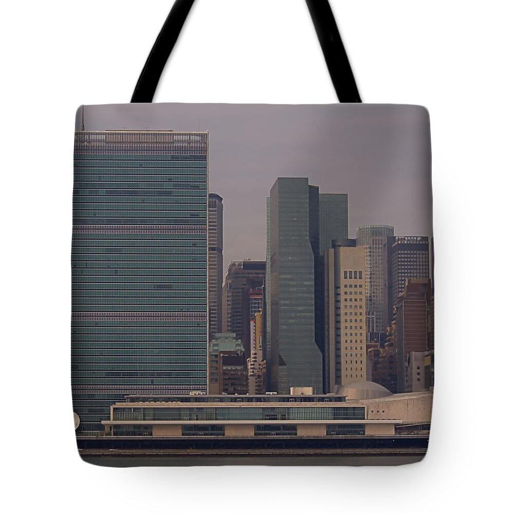 Un Tote Bag featuring the photograph United Nations by Newwwman