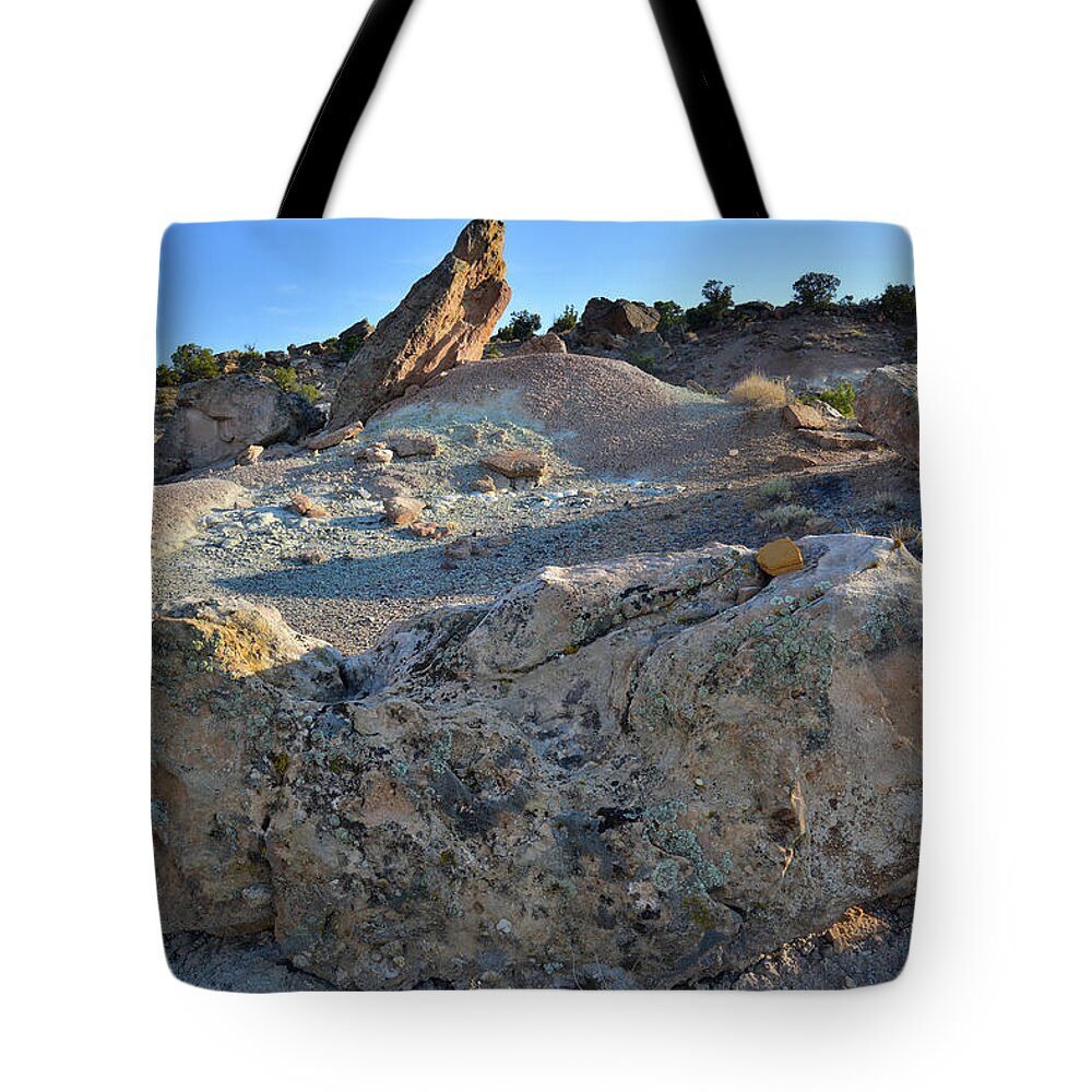 Grand Junction Tote Bag featuring the photograph Uplifted Boulder in Bentonite Quarry by Ray Mathis